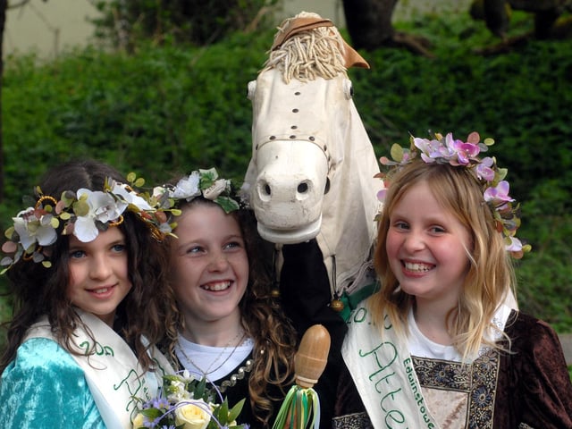 May Queen Chloe Hodgson, centre, is pictured with her attendants, Harriet Rhodes on the left and Olivia Bradley, as the Morris Men’s horse joins in the photo at the Edwinstowe May Day Festival in 2010.