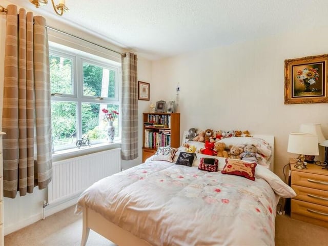 Bedroom number four, which could be ideal for a child, is a lovely, bright space. It also has fitted wardrobes with hanging rails and shelving.