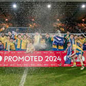 Stags beat Accrington 2-1 to seal a spot in League One next year.