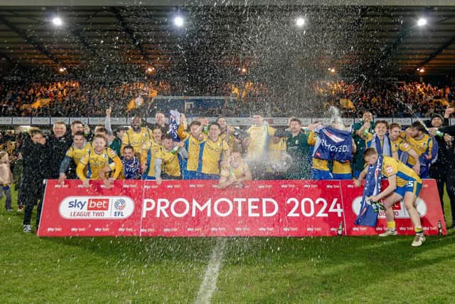 Stags beat Accrington 2-1 to seal a spot in League One next year.