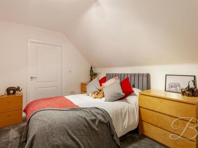 The fourth and final bedroom is compact but decidedly pleasant. The floor is carpeted. Like all the other bedrooms, it has access to en suite facilities.