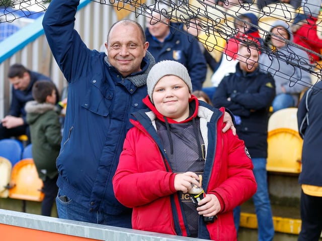 Mansfield Town fans watch the match against Northampton Town.