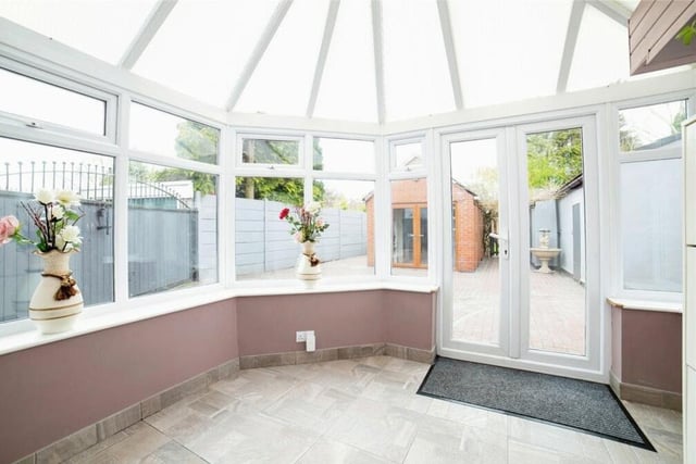 At the back of the Kirkby property is this bright conservatory that can be put to multiple uses. It has a tiled floor and French doors leading to the rear garden.
