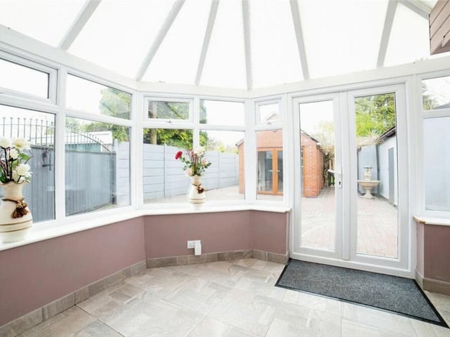 At the back of the Kirkby property is this bright conservatory that can be put to multiple uses. It has a tiled floor and French doors leading to the rear garden.