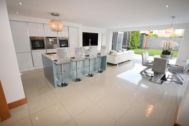 The property's huge kitchen diner can only be described as spectacular. This is our first shot of it, showing how amazingly presented and decorated it is, with the coup de grace being those bi-folding doors that invite you into the back garden.