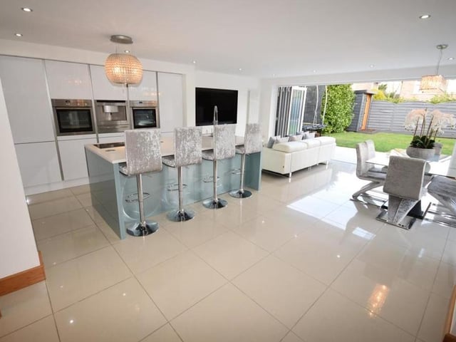 The property's huge kitchen diner can only be described as spectacular. This is our first shot of it, showing how amazingly presented and decorated it is, with the coup de grace being those bi-folding doors that invite you into the back garden.