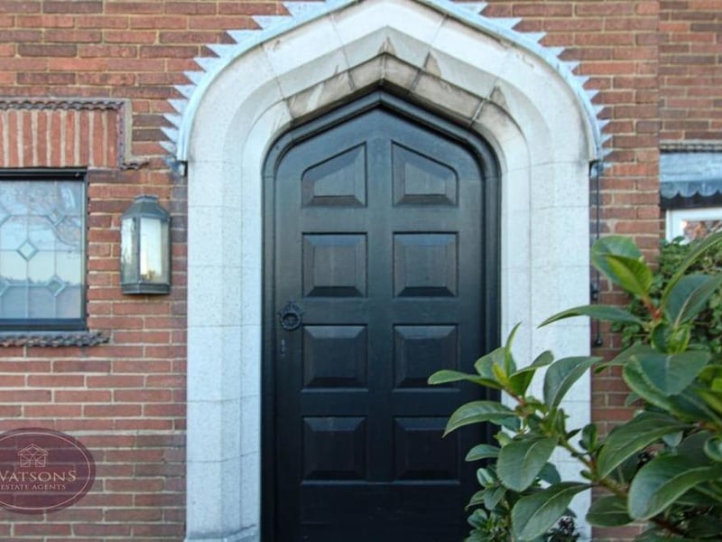 Let's step outside now for a grand tour of the amazing exterior -- and what better place to start than the imposing entrance door at the front which is made out of solid oak.