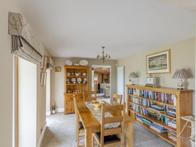 Next stop is the well-presented dining room, which has a carpeted floor and an opening through to the lounge.