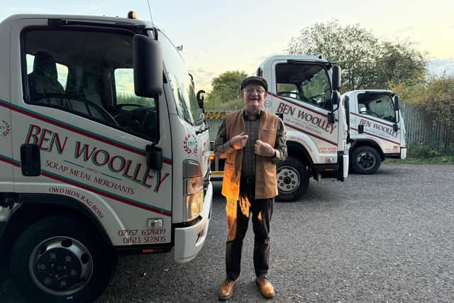Ben Woolley pictured with three trucks from the family run business
