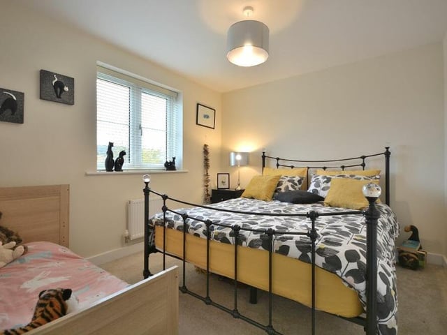 This double bedroom is a delightful retreat. Stylishly presented, it faces the front of the £365,000 property.