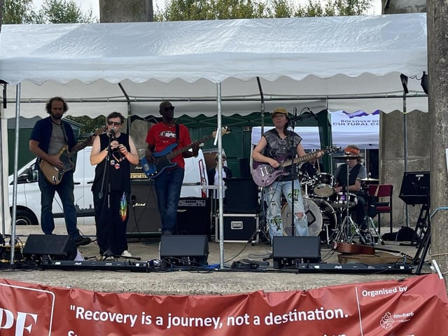 The SkinTones performed at the festival. The band is a diverse anarcho-confusion band that blends reggae, funk, folk, ska, trance, hip hop, psychedelic rock, rap, and ancient vibes to spread love and respect through their music.