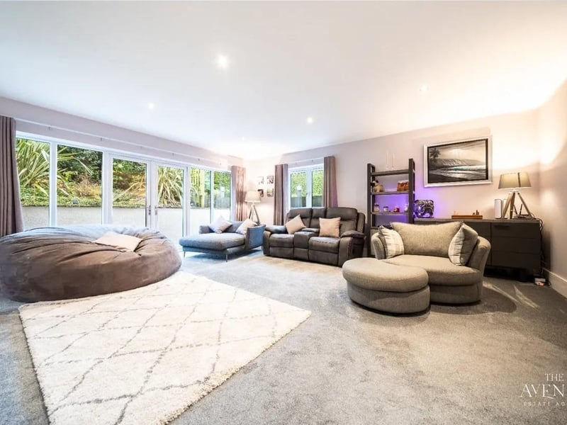 This glorious split room reception area, boasts beautiful windows as well as two sets of french doors which provide access to the side of the property, which in turn lead to the garden.
