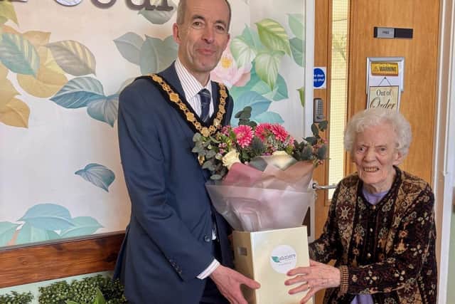 Councillor Richard Butler thanking Care Home resident Marilyn Clarke for her service in the home.