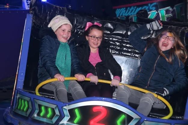 Squeals of delight from Chloe Bramley, Amy Challenger, and Ella Bramley as they brave a spin on the Waltzer back in 2019