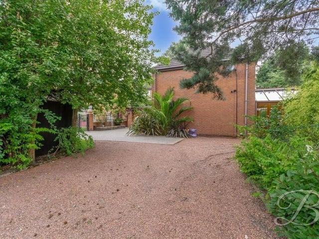 The property's grounds contain off-street parking space for multiple vehicles.