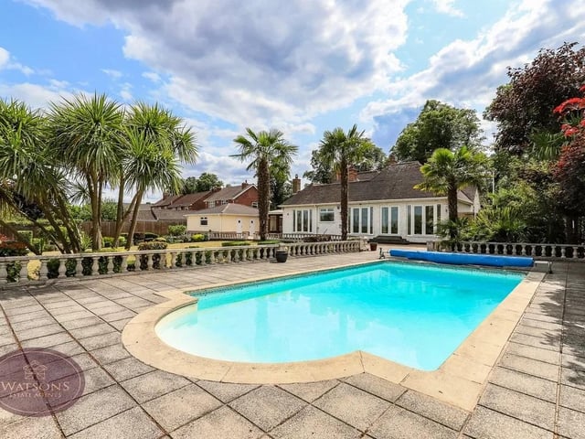 A simply stunning, prestige detached home located in Nuthall. Sitting on a wonderful 0.6 acre plot with open countryside views to the rear, this home must be viewed to be appreciated. The generous rear garden offers a good level of privacy and comprises a spacious covered terrace area, gravel path, feature decorative stone borders, full size heated swimming pool with paved patio seating area and access to the brick built outside bar with light and power. Brick built summer house with uPVC double glazed windows, WC and shower room. Other features included a generous lawn, flower bed borders with a range of mature plants, shrubs and trees and a brick built workshop with WC.