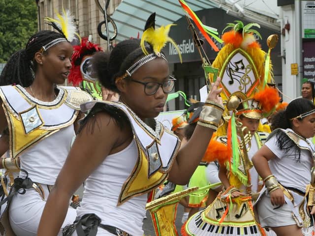 The carnival is part of celebrations for the 75th year since the Windrush generation. Pictured - dancers taking part in the parade, marching from Mansfield Museum down to the Market Place.