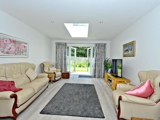 Next stop at the £450,000 Forest Town bungalow is this lovely, relaxing lounge which, like the kitchen diner, has uPVC double-glazed doors that give access to the pleasant garden, plus a roof light window with electric blind.