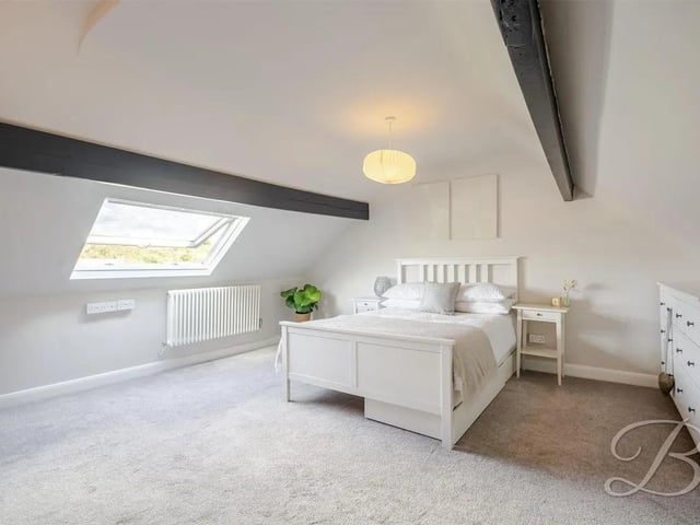 The top floor bedroom features exposed beams.