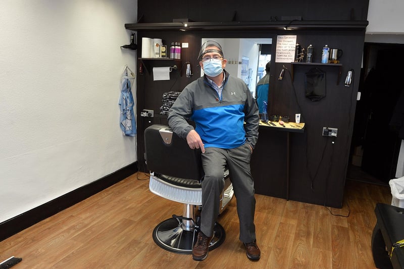 Many locals get their haircut and have a good chat at Andrews barber shop. Pictured is Andrew Hoy during the days of COVID.
