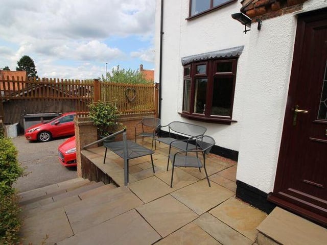 Let's take a look round the exterior of the Ollerton cottage now, starting with this quiet seating area outside the front door.