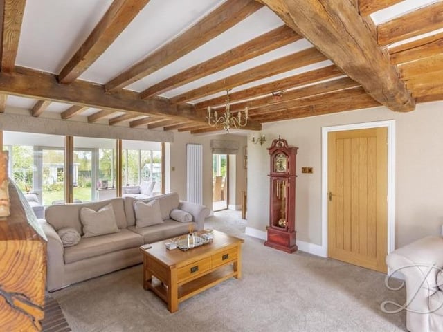 A third and final shot of the bright and cosy lounge at the £750,000 property.