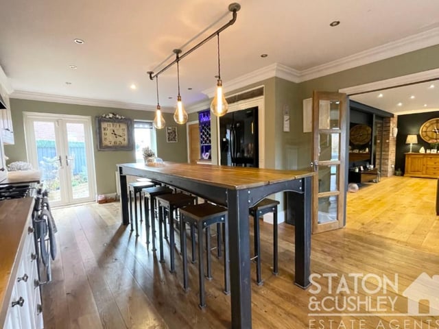 Moving seamlessly from the lounge into the kitchen/diner, which is another fabulous asset. As you can see, it includes French doors that open out to the front of the house.