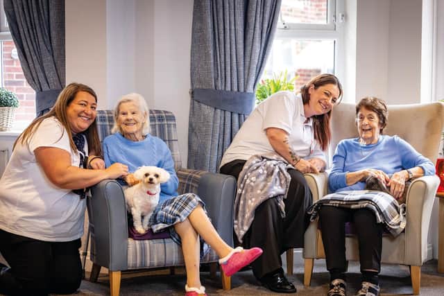 Staff and residents with animals at a HC-One care home