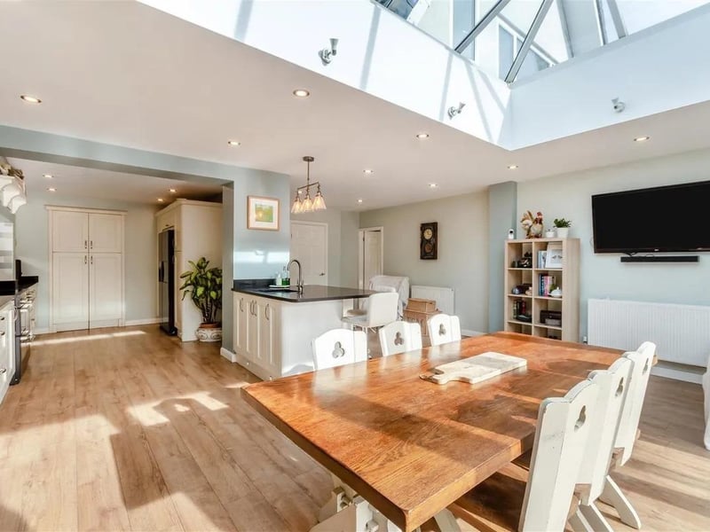 The heart of the home is a substantial open plan living/dining/kitchen with island, walk-in pantry, ceiling lantern to the dining area and bi-fold doors leading out onto the south facing rear garden.