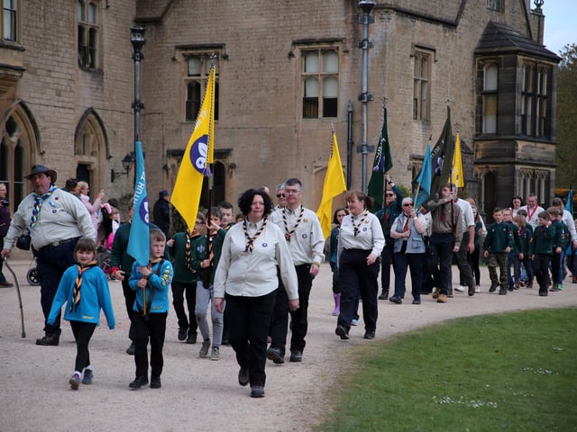 A parade moves towards the front of the Newstead Abbey for their inspection and renewing of the scouts promise.in April 2019