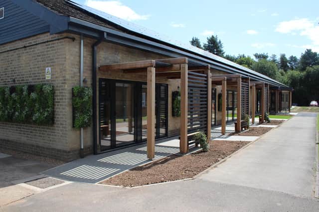 The stunning & modern outside vista of the Pines residential building.
