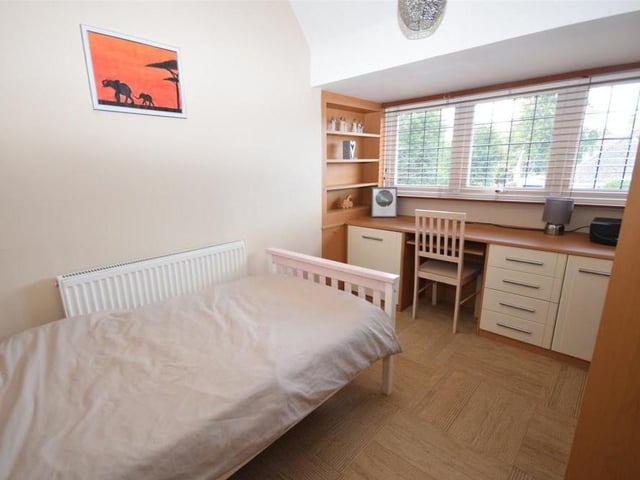 Bedroom number four is well proportioned, with a fitted desk and shelving. It overlooks the front of the property.