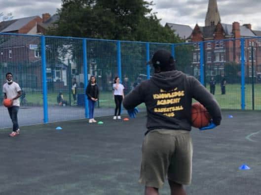 The first kids to enjoy the roadshow got to play basketball and shoot some hoops.