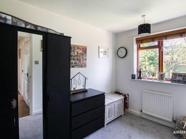 The fourth bedroom might be smaller than the other three, but it benefits from a built-in storage cupboard. Again, the floor is carpeted.