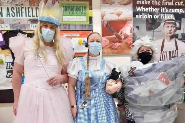 Staff from Kirkby Morrisons dressed as characters from the Wizard of Oz