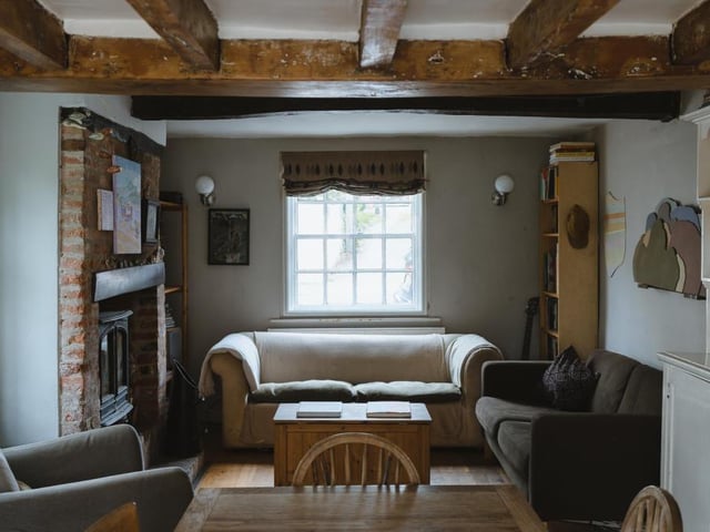 We begin our 'grand tour' of the Southwell property in the open-plan living room and diner, which also accommodates the kitchen. Large, original beams run overhead to sum up the character of the property. The space is bathed in light thanks to windows on the north, west and south axes.