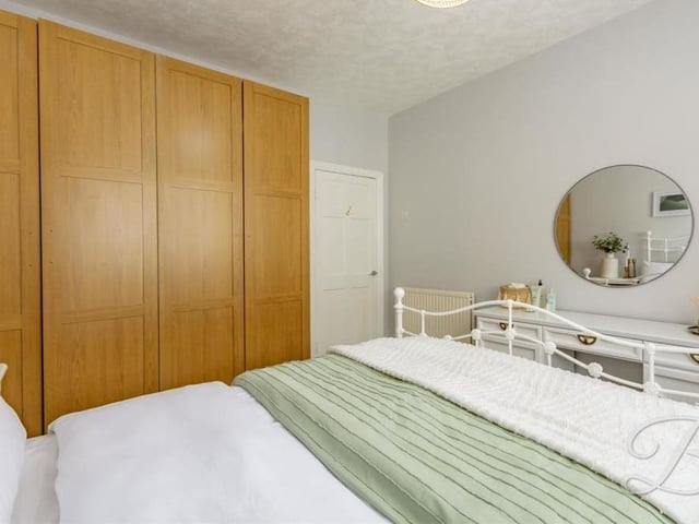 There is lots of space for wardrobes in the second bedroom.