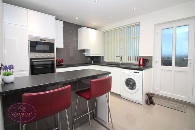 The breakfast kitchen has an appealing feel to it because it is newly-fitted. Integrated appliances include an electric oven and microwave, and electric hob with extractor over. There is also plumbing for a washing machine, while the door leads to the back garden.
