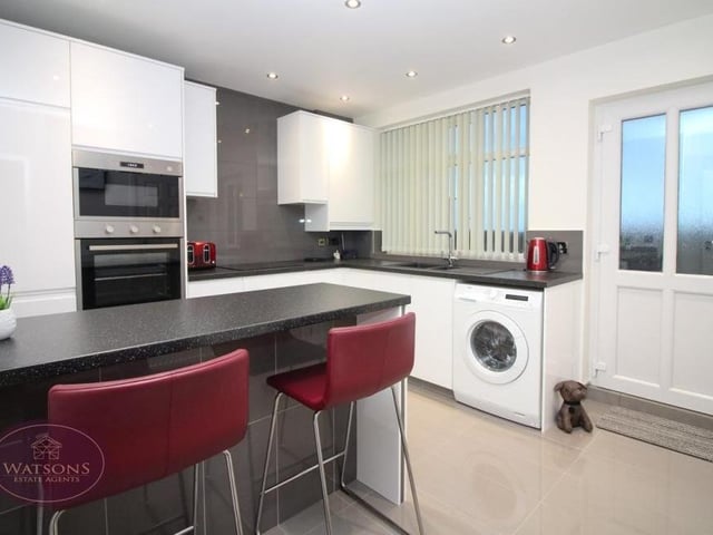 The breakfast kitchen has an appealing feel to it because it is newly-fitted. Integrated appliances include an electric oven and microwave, and electric hob with extractor over. There is also plumbing for a washing machine, while the door leads to the back garden.
