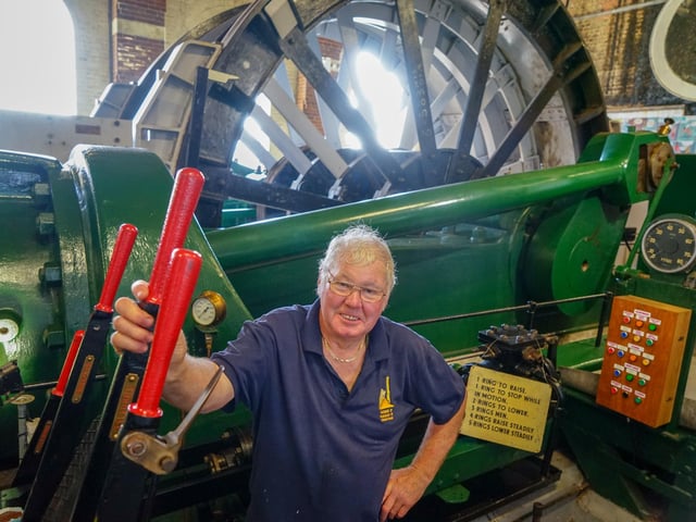 Tony White of Pleasley Pit, next to a 1923 Markham engine.