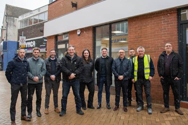 Coun Matthew Relf with staff from Miller Knight who carried out the renovations, and Kinver project managers, outside the transformed former bank.