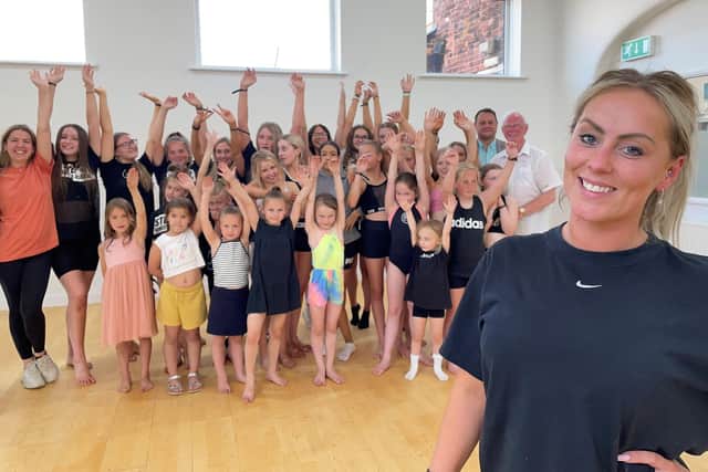 Tiffannie with her staff and students at the new academy.