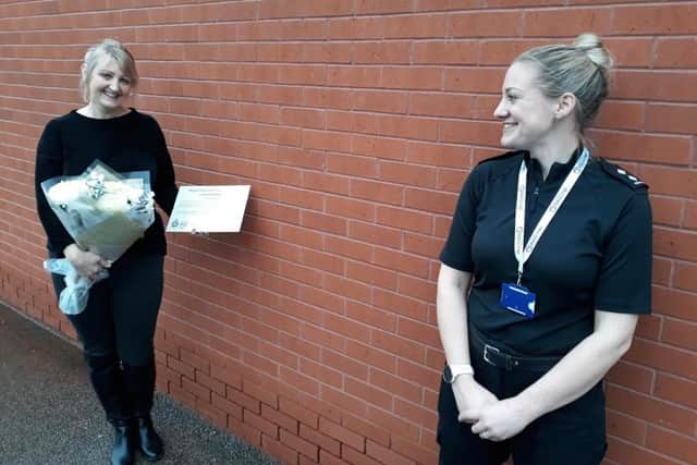 Former Nottinghamshire police officer Paul Roker, left, receives her commendation at last year's policing awards.