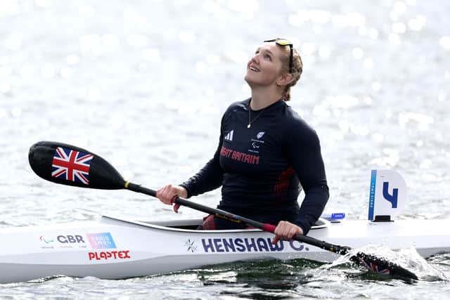 Charlotte Henshaw celebrates winning gold in the Women's Kayak Single 200m final in Paris.