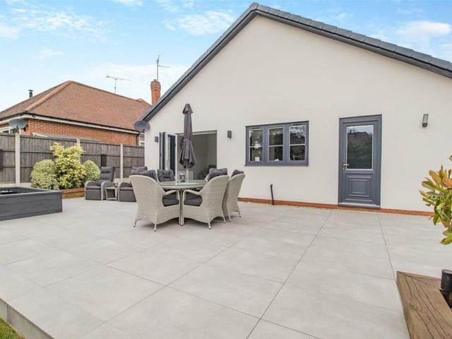 You've seen the front and you've seen the side of the Forest Town bungalow. Now here' s a view of the rear, showing how the bi-folding doors from the open-plan kitchen lead on to a sizeable porcelain patio.