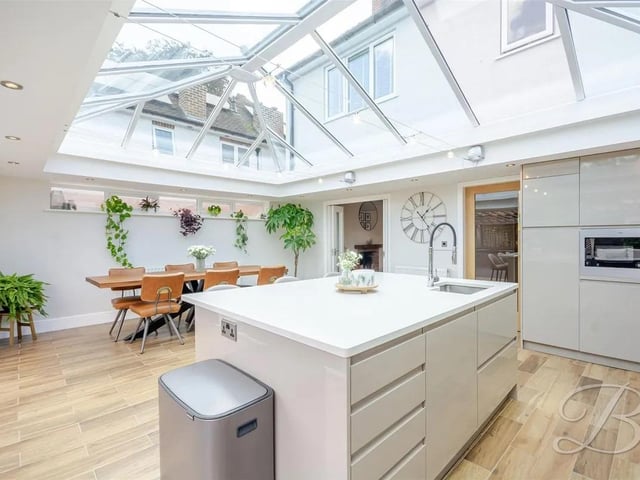 The kitchen is bathed in natural light, creating a warm and inviting atmosphere.