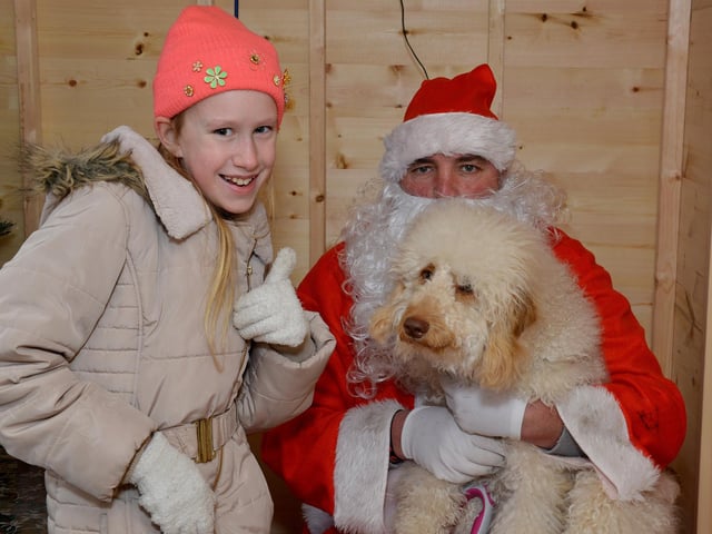 Santa Paws Dog Grotto at Mansfield Market in aid of Guide Dogs for the Blind Association, pictured is Kiera Cooper-Fiddler, 10 and Poppy meeting Santa