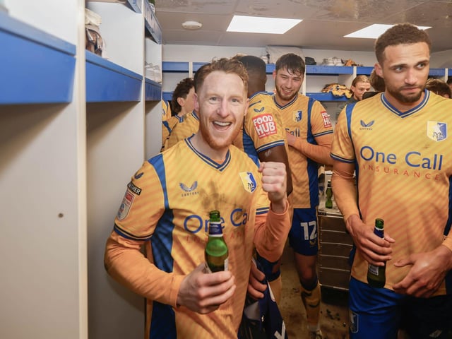 Mansfield Town's fans and players celebrated promotion to League One long into the night.