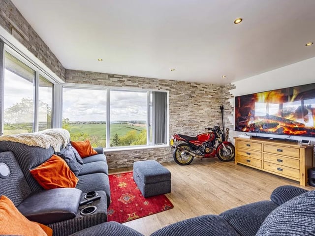 The living areas are bathed in natural light thanks to large rear-facing windows