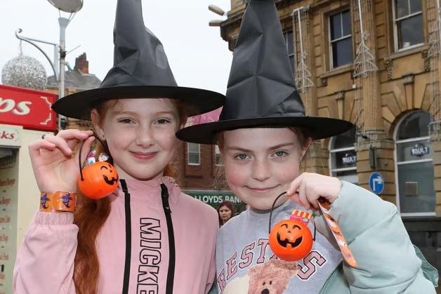 Kiara-Rhiann Woodward and Miley-Rose Bevan in 2023 showing off their Halloween goodies at Mansfield Market Place